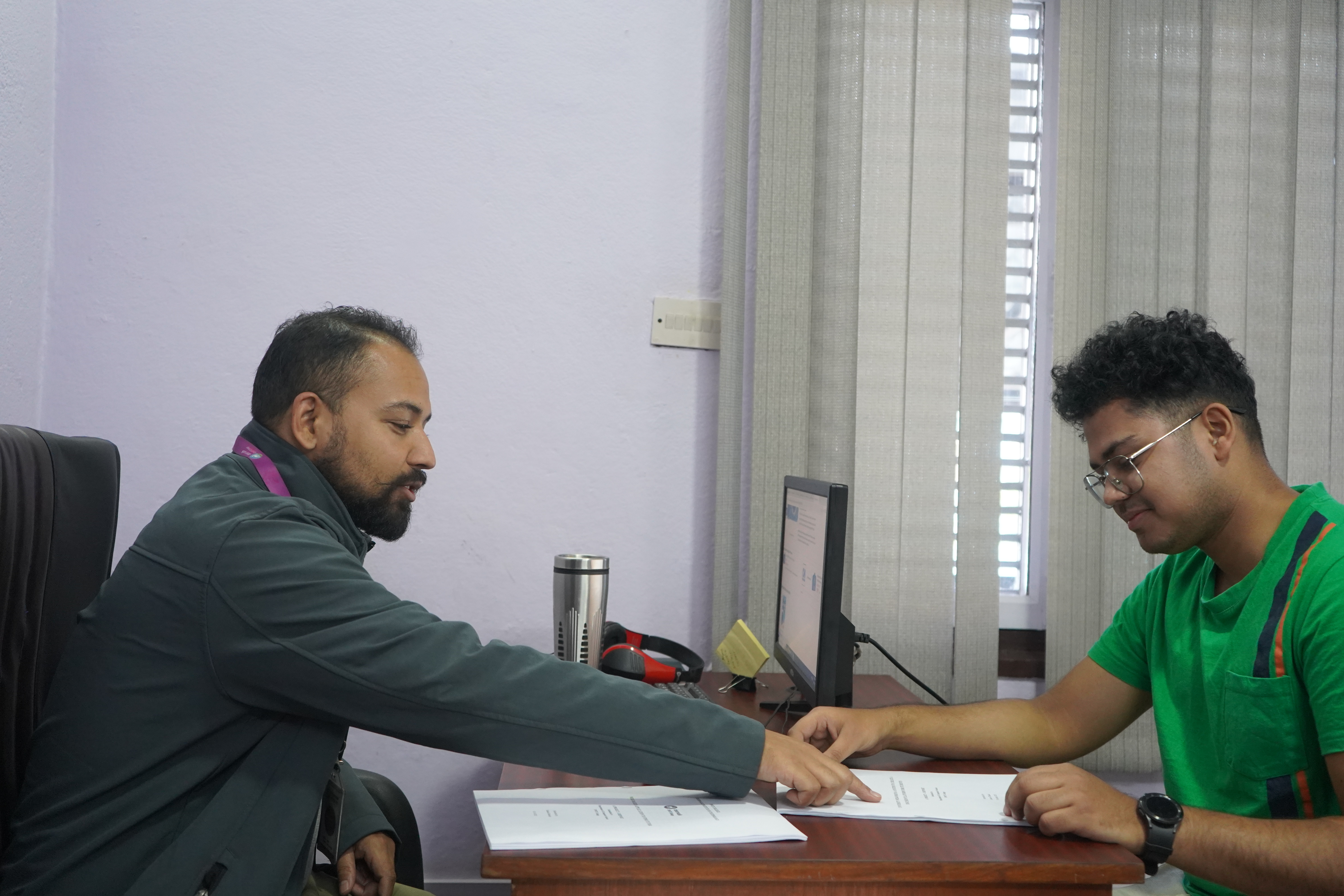 a lecturer at dwit,beside the whiteboard