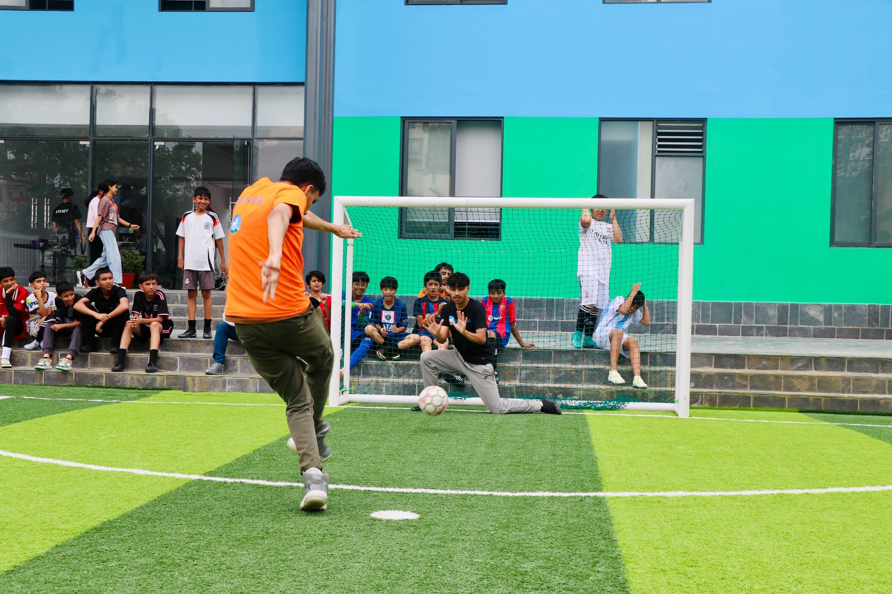 boys playing basketball in the court